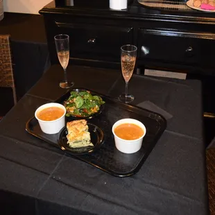 a tray of soup and a sandwich