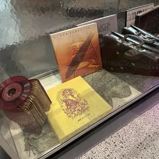 a display case with various records