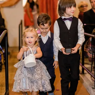 a group of children dressed in formal attire