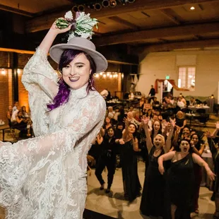 a woman in a wedding dress and hat