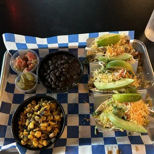 Street taco combo plate with corn and black beans, salsa and jalapeños.)