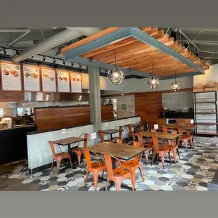 a dining area with tables and chairs
