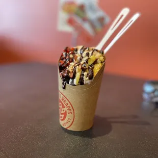 Soft serve (Strauss) with the Hawaiian macadamia nut, mango and chocolate drizzle