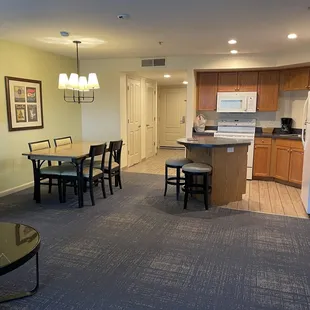 View of kitchen dining room and front door from back door/ Murphy bed on RT side