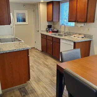 Full size fridge, electric stove, oven, microwave and dishwasher.