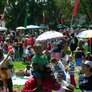 a crowd of people in a park