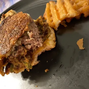 Dry chili burger with half burnt bun and soggy waffle fried