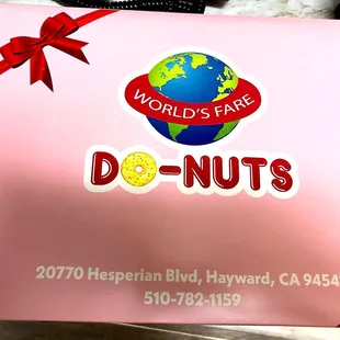 a pink box with a red ribbon