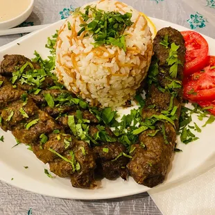 a plate of meat and rice