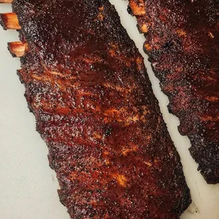 two ribs on a cutting board