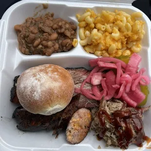 This is a three item combo with two sides! We had brisket pulled pork and jalapeño w/beans, biscuit, and mac &amp; cheese.