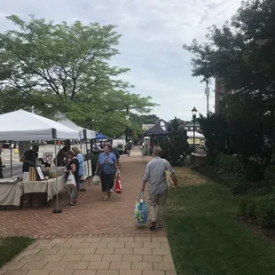 people walking down the sidewalk