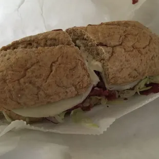 Pastrami on a wheat roll w/ lettuce, tomato, onion and mayo. Yummy!!!