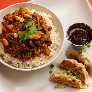 a plate of food with rice and dumplings