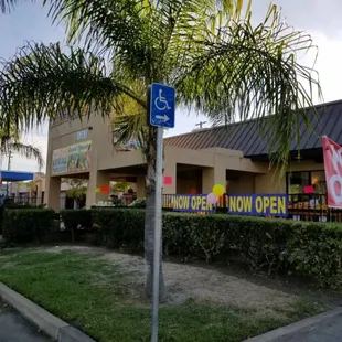 a street sign in front of a store
