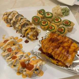 Yum Yum Roll , Salsa Roll, Dynamite Roll, and the one on the far left is the honor roll