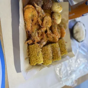 Shrimp head on 2 hard boiled eggs 4 corn and 2 potato chunks and dice of white rice (cooked)