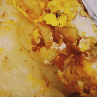 Breakfast taco: potato, bacon, egg, and cheese