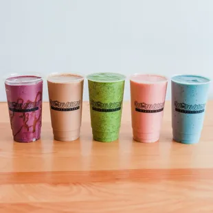 a row of smoothie drinks