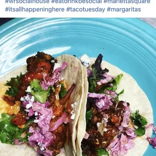 two tacos on a blue plate