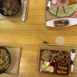 Top left clockwise: BBQ Pork Yakisoba, Grilled Chicken Fusion Quesadilla and Chicken Eggrolls, Asiate Box, Shirmp Yakisoba