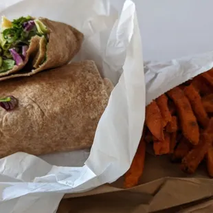 a burrito and sweet potato fries