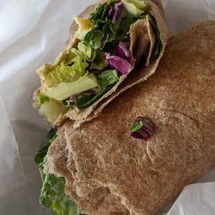 a closeup of a wrap with lettuce and lettuce