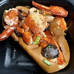The Notorious B.L.T which stands for Butter, Lobster,Truffles. Made of Brown Butter, Lobster, Truffles, on a Toasted N.E. Roll
