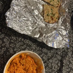 Chicken macknhi, rice, and Garlic Naan