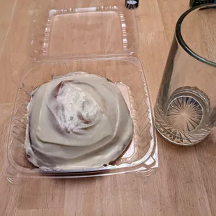 GIANT cinnamon roll, with a half-litter mug shown for scale