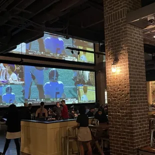 a crowd of people watching a video game