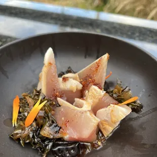 Albacore sashimi with garlic chili and black peppered collards