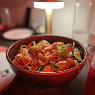a bowl of noodles and vegetables