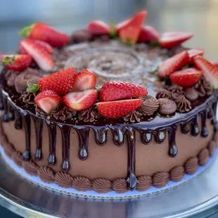 a chocolate cake with strawberries on top