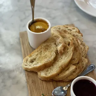 Grass-fed Ricotta with truffle honey, sourdough, compote, and roasted garlic.