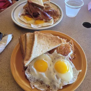 #1 with sunny side eggs. Mine has portuguese sausage. His has ham aka bacon. Was expecting ham sliced but bacon is always welcomed.