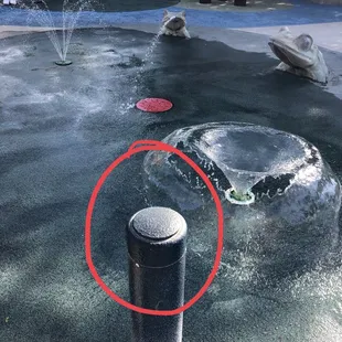 tap top/side of pole to turn on water (not a button, just a sensor)