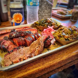 Texas Trinity $26 - Brisket, ribs and jalapeño cheddar sausage with Collard Greens &amp; Brussel sprouts