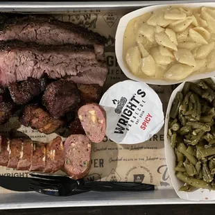 Texas Trinity Plate. 3 meats and two sides.