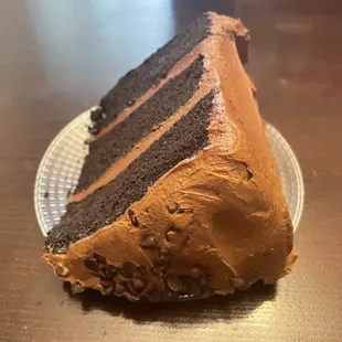 Got a huge slice of rich 3 layer chocolate cake that barely fits on the plate, Wrights gourmet deli, South Tampa