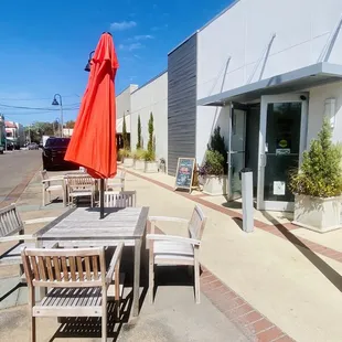 Sunny outdoor seating &amp; parking at rear entrance.