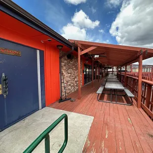 There is outside seating to the right of the entrance.