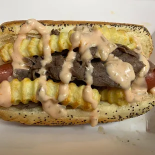 a hot dog covered in mustard