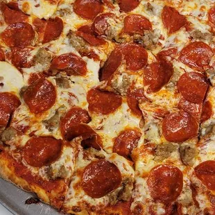 Chicago Style Thin Crust Pizza, Homemade dough and marinara, cut in squares