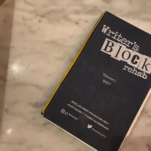 a book on a marble table