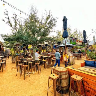 a patio area with tables and chairs