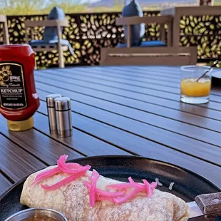 Breakfast burrito, salsa verde on the side.