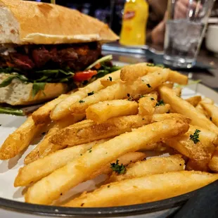 a plate of french fries and a burger