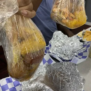 a person holding a bag of food