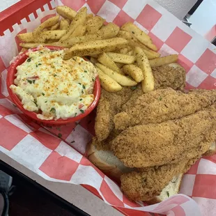Fried fish platter with fries and potato salad